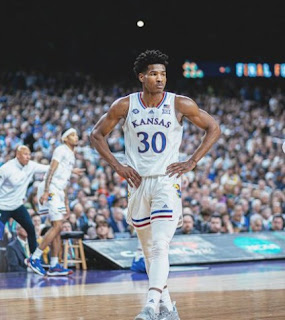 Ochai Agbaji playing basketball for his team