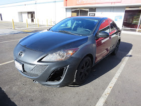 Mazda 3 with peeling Plasti Dip before repainting at Almost Everything Auto Body