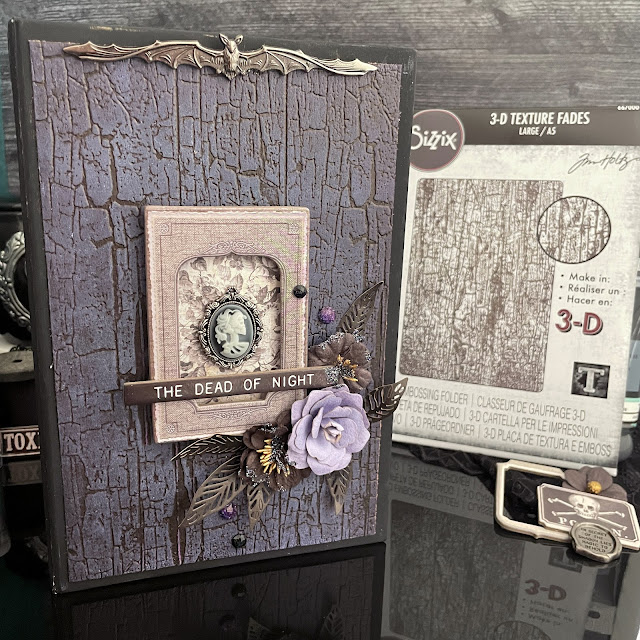 Lit Halloween book box decorated with Tim Holtz Halloween Idea-ology; Tim Holtz Distress Inks and Sprays; and Tim Holtz Sizzix Haunted House Thinlit and Cracked A5 Texture Fade embossing folder.