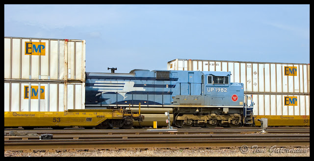 Union Pacific 1982 sits between double stacks at Dupo Yard in Dupo, IL.