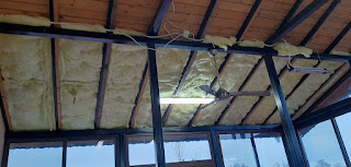 Putting rock wool insulation in