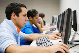 Young man in high school computer lab