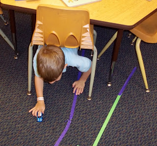 Masking tape roads under table (Brick by Brick)