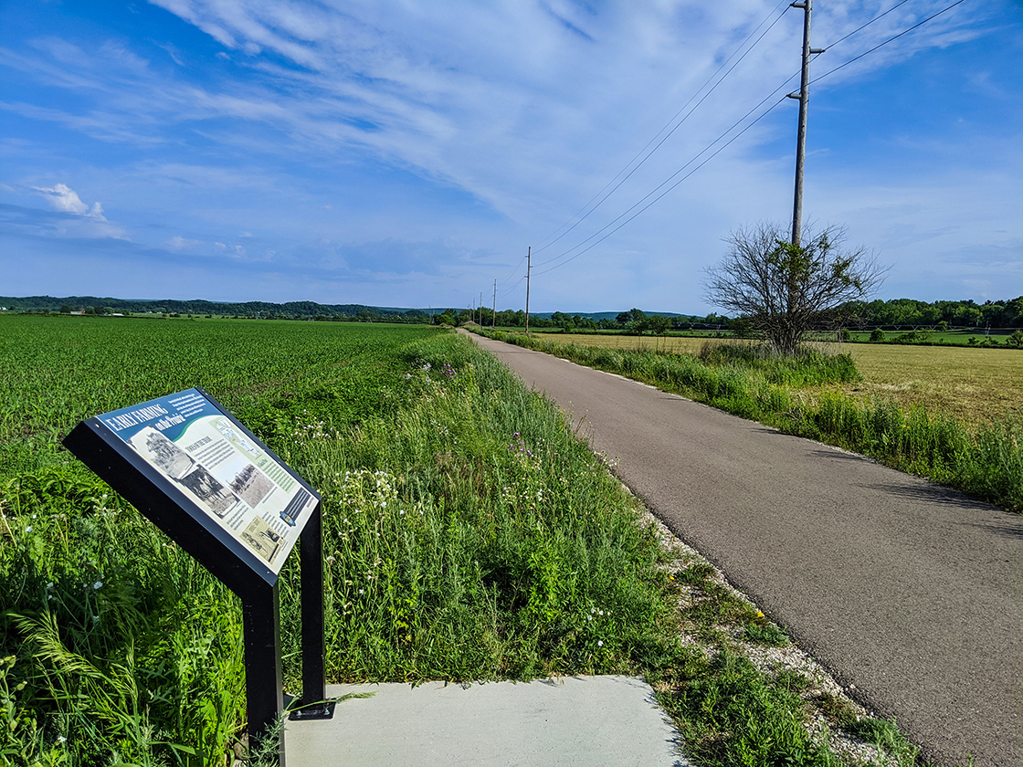 Trail cutting through grasslands