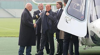 Silvio Berlusconi arrives to AC Milan's training camp in Milanello on his helicopter