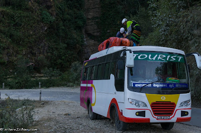 our daily commute tieing kayaks ontop of a bus in nepal himalayas Upper Marsyangdi river whitewater, Nepal, WhereIsBaer.com Chris Baer