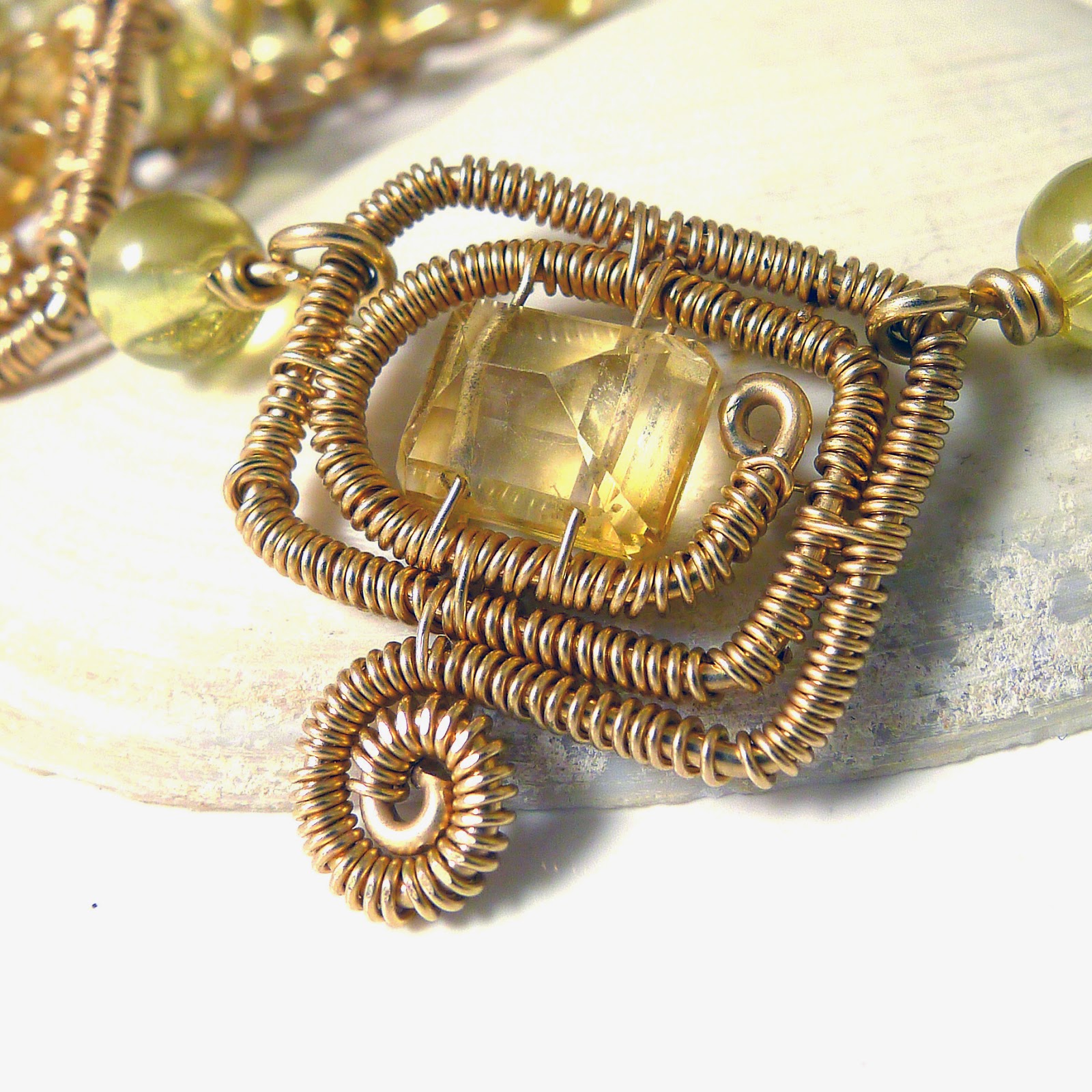 http://www.shazzabethcreations.co.nz/#!product/prd1/2536451321/citrine-and-topaz-14k-gold-motif-necklace