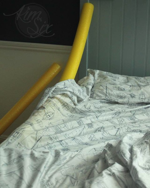 Inserting pool noodle as bed rails