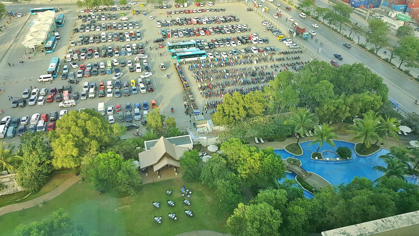 MyBus parking lot, swimming pool and Urban Table as seen from one of the windows of room 1501 at Radisson Blu Cebu Hotel