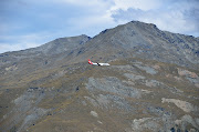 Here is a close up of one of the farms nestled up against the mountains. (dsc )