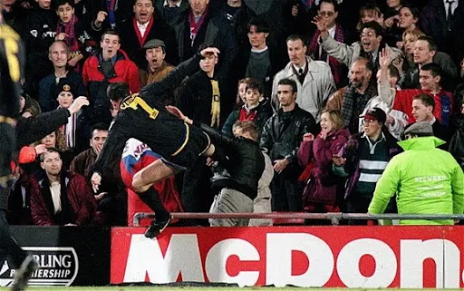 Eric Cantona launches his infamous kung-fu kick on a Crystal Palace fan at Selhurst Park