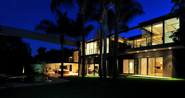 Picture of renovated house as seen at night from the backyard