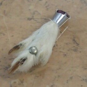 Grouse foot brooch with a silver ring