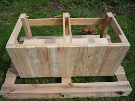 finishing the frame of diy pallet wood dry toilet