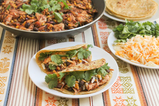 Food Lust People Love: The filling for these Southwestern Chicken Tacos includes corn, black beans, tomatoes, jalapeños, onions and cilantro so, to serve, all you need to add is cheese and the tortillas! (And extra cilantro, if desired.)