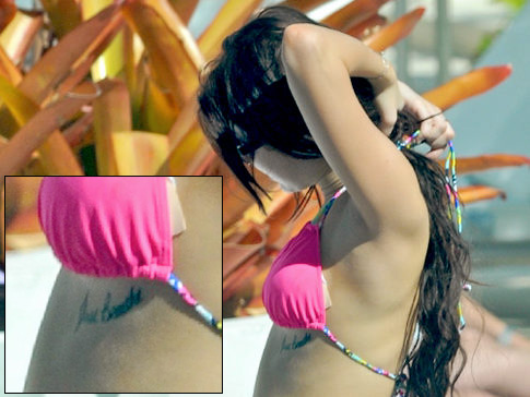 miley cyrus tattoo on her stomach. lil rebel, Miley Cyrus.