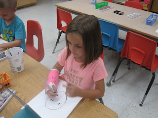 girl drawing on paper