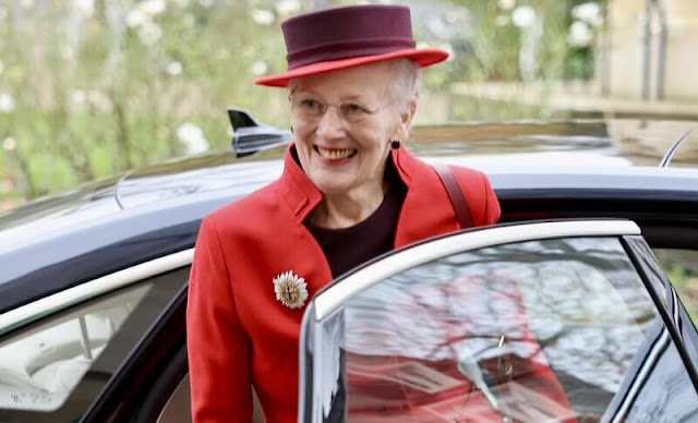 Queen Margrethe wore a red wool jacket and burgundy midi dress. The Queen wore her Order of the Garter