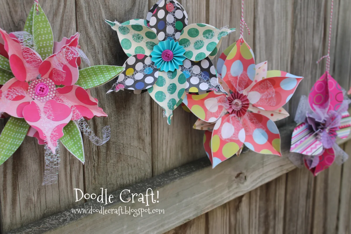 how to make 3D snowflakes or flowers using a cutting machine and bright paper.