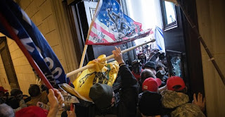 Others protesters moved to the back quickly pushing through a line of police.   Some Trump supporters entered the Senate floor to protest against the election results. Inside the building, an armed stand-off broke out in the House chamber.  Officers drew their guns on a protester trying to reach the front door.