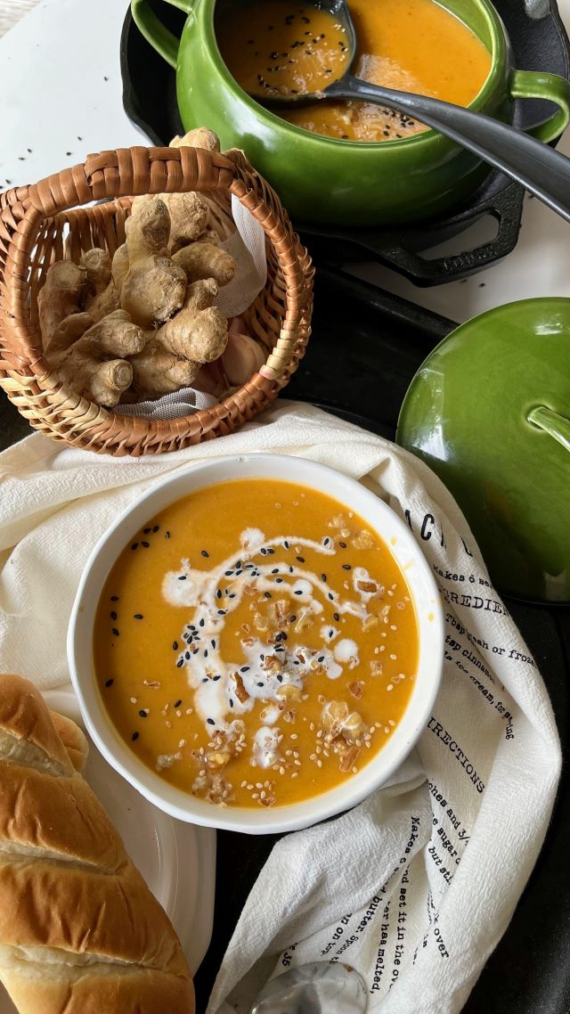 Vegan Carrot, Ginger and Sweet Potato Soup in a green soup tureen with a basked of ginger, Vegan,  sesame seeds, vegetarian, one-dish, soup stock, Indian, healthy, walnuts, coconut milk, Asian, autumn, fall, harvest