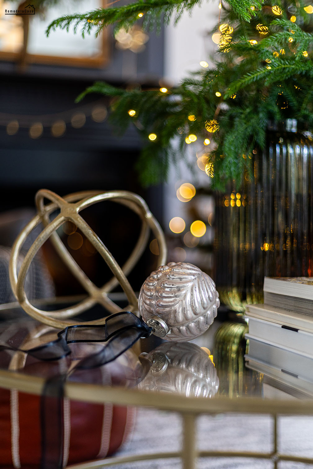 gold orb and ornament on glass coffee table