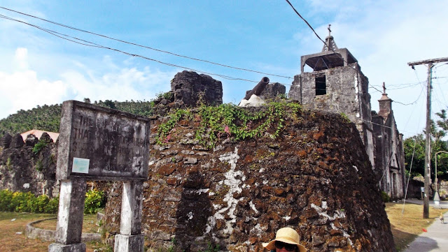 street view of the cannon mount with church in the background at Capul Church fortress