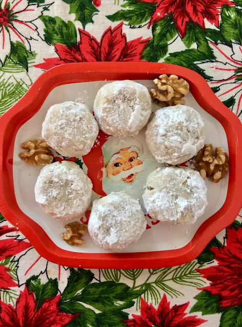 Santa plate with Mexican wedding cake cookies and walnuts.