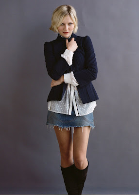 Kirsten Dunst looks cute in a skirt