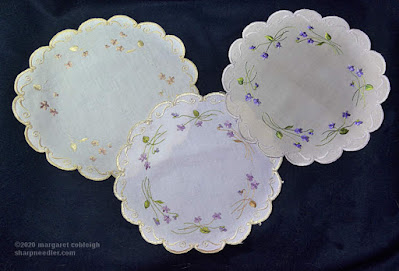 Society Silk Violets: Two antique and one newly-stitched version of the same Society Silk violet design