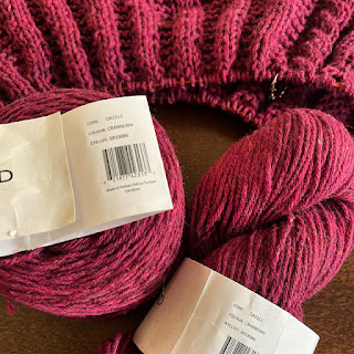 A wip and balls of Cranberry Estelle Eco Shetland Worsted yarn showing the exact same dye lots even though the yarn was purchased a year apart from two separate shops in two separate provinces!