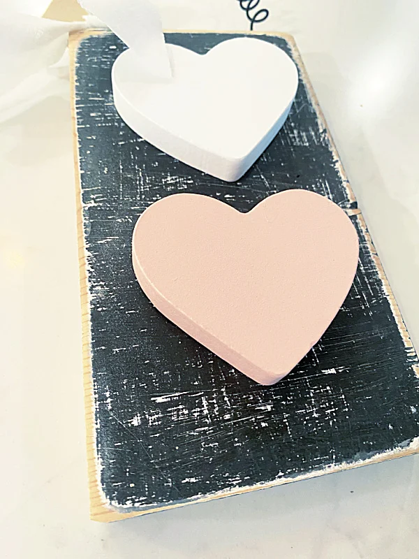 hearts glued to rustic board