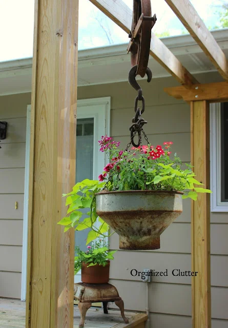 Photo of a junky planter with pulleys.