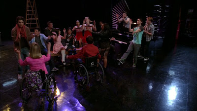 The glee kids all jamming together in the auditorium