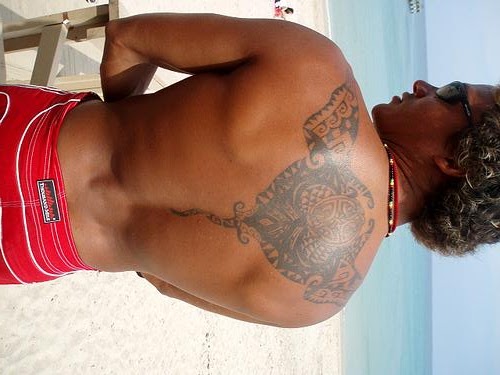 Traditional Hawaiian Tattoos are applied with a sharpened bone chisel and 