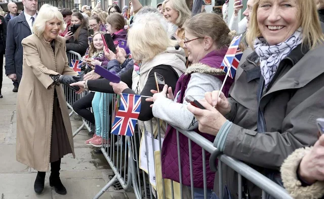 Queen Camilla visited the recently restored Shrewsbury Flaxmill Maltings. Queen Camilla wore a camel coat and fly and bee brooch