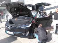 Tesla Model X. You can carry a small bag in the front.