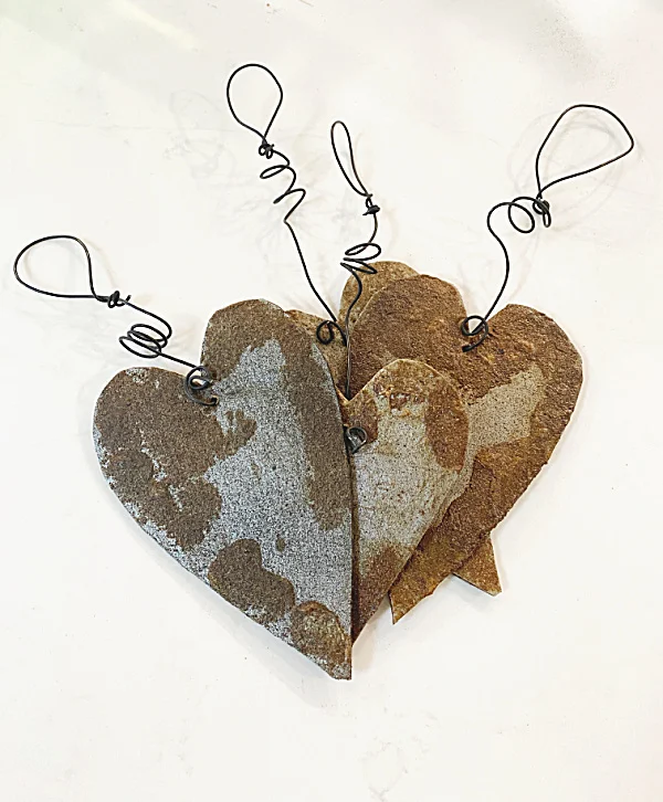 4 rusty hearts with wires