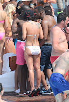 Tulisa Contostavlos ass in a white string bikini