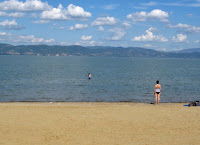 View of the sandy beach located next to Castiglione del Lago, Umbria, Italy