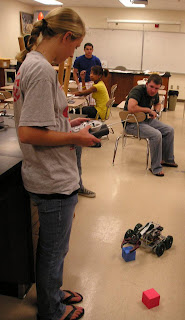 Kristina DeCarlo controls the VEX protobot during ELEVATION practice