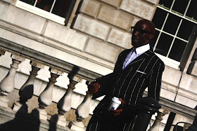 Deigh Alex wearing a pinstripe suit during london fashion week ss14