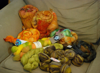 Combospin stashed braids of dyed fibre in oranges and yellows and browns