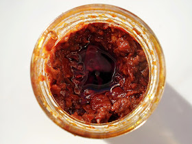 open jar of harissa paste