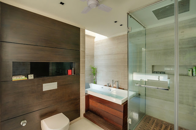 Picture of modern bathroom with dark wood on the wall