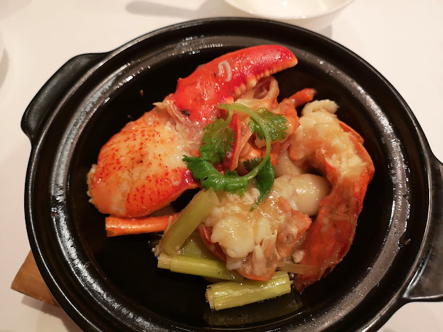 Stewed Boston Lobster with lemongrass and garlic served in a claypot  