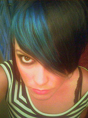 This gorgeous emo girl has the most beautiful blue hair color in her side 