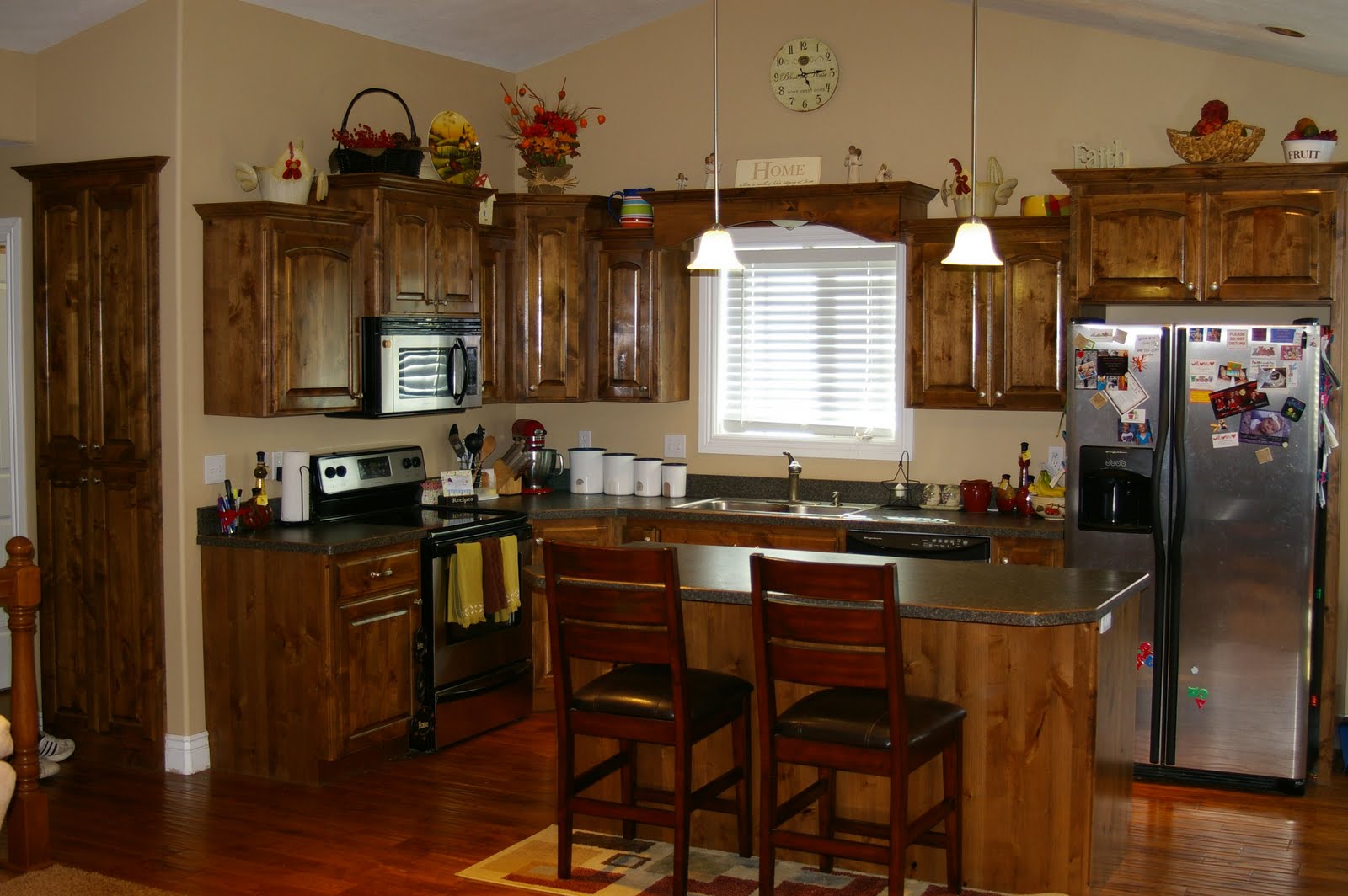 elegant bathroom vanities  beautiful knotty alder cabinets, including a large island and pantry