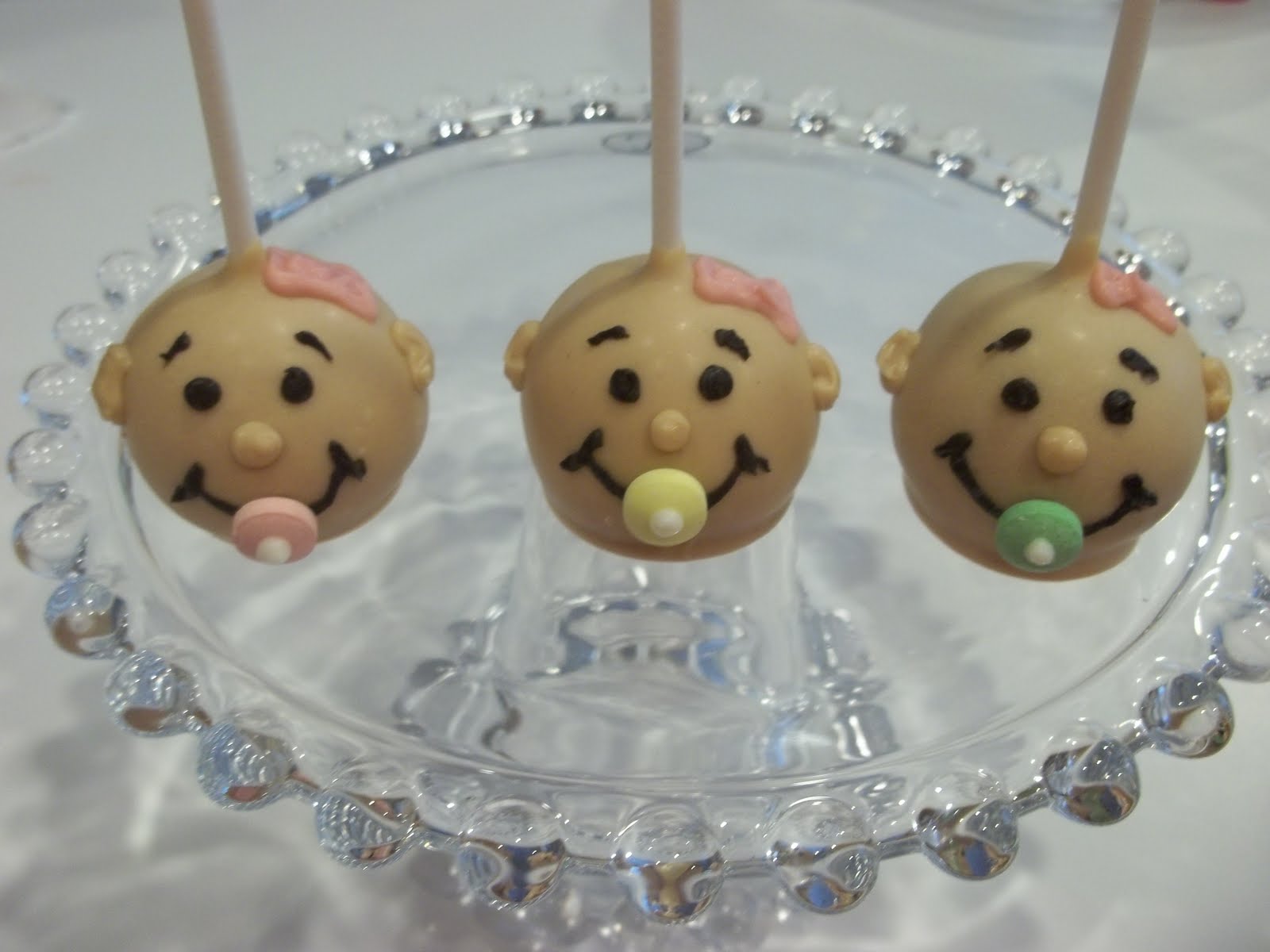 baby shower cake pops images You've got the cutest little baby face!