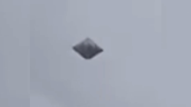 Huge Diamond shaped UFO filmed over Medellin In Colombia for over an hour.